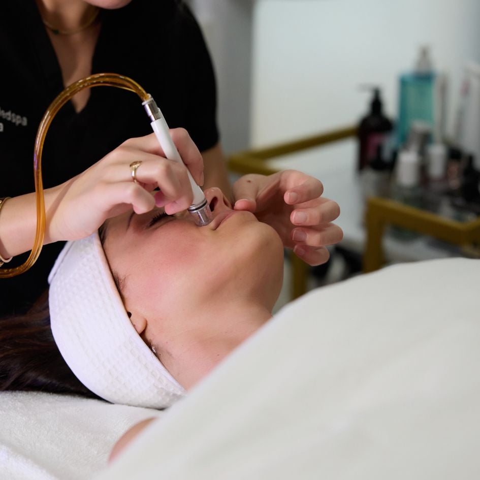 Woman getting diamond glow treatment