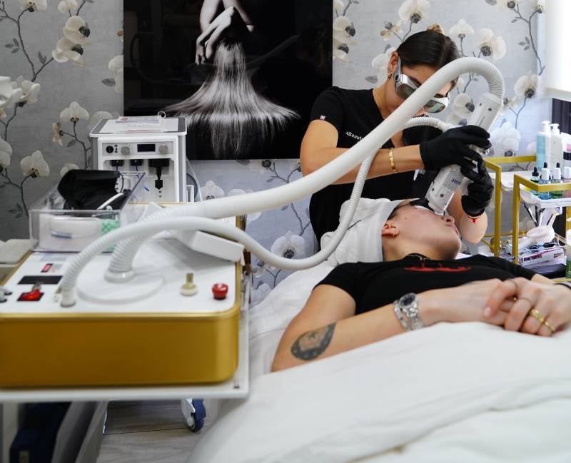 A person's leg being massaged