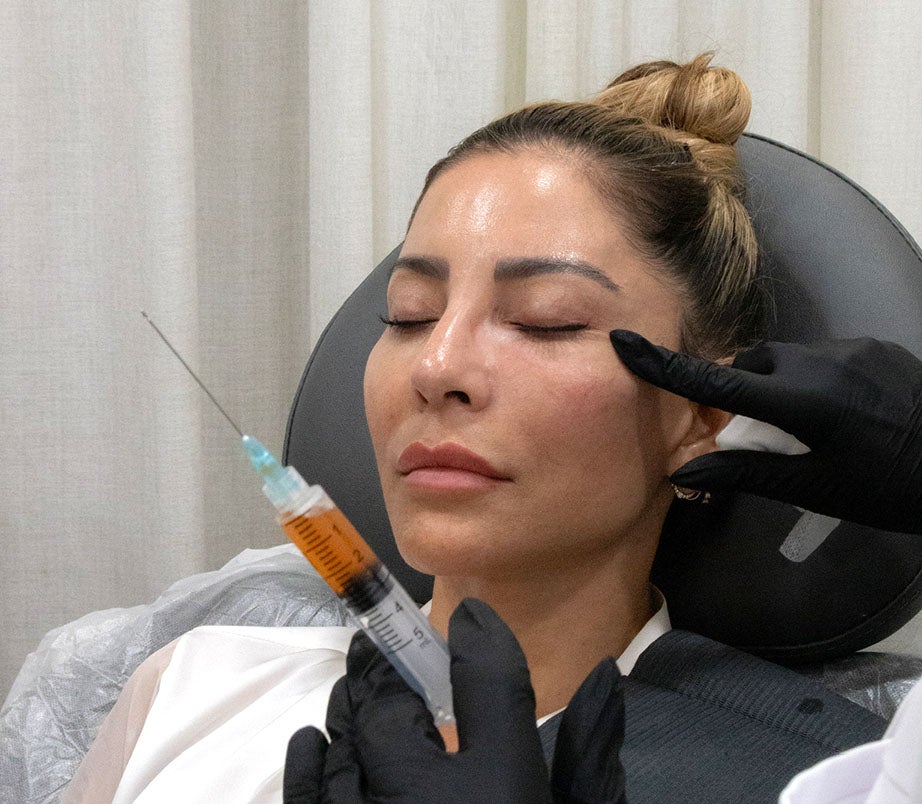 Woman getting a face injection