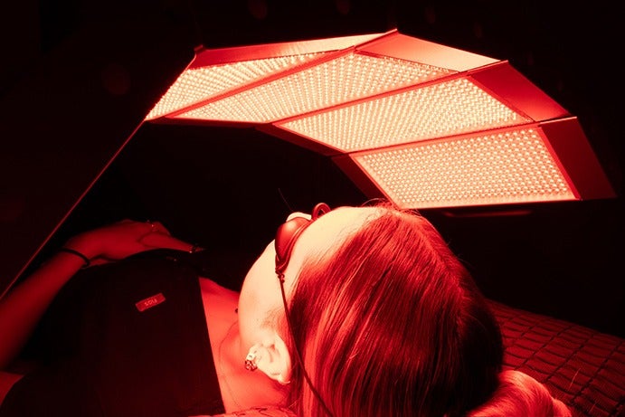 A woman getting red light therapy