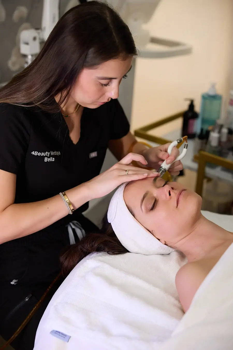 Woman getting diamond glow procedure